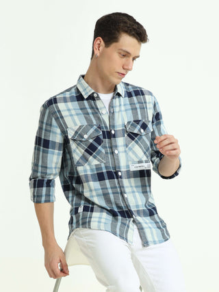 Indigo check double pocket shirt shop online at Estilocus. 100% Cotton • Full-sleeve check shirt• Cut and sew placket• Regular collar• Double button edge cuff• Double pocket with flap• Curved bottom hemline .• All double needle construction, finest qualit