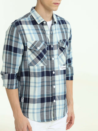 Indigo check double pocket shirt shop online at Estilocus. 100% Cotton • Full-sleeve check shirt• Cut and sew placket• Regular collar• Double button edge cuff• Double pocket with flap• Curved bottom hemline .• All double needle construction, finest qualit