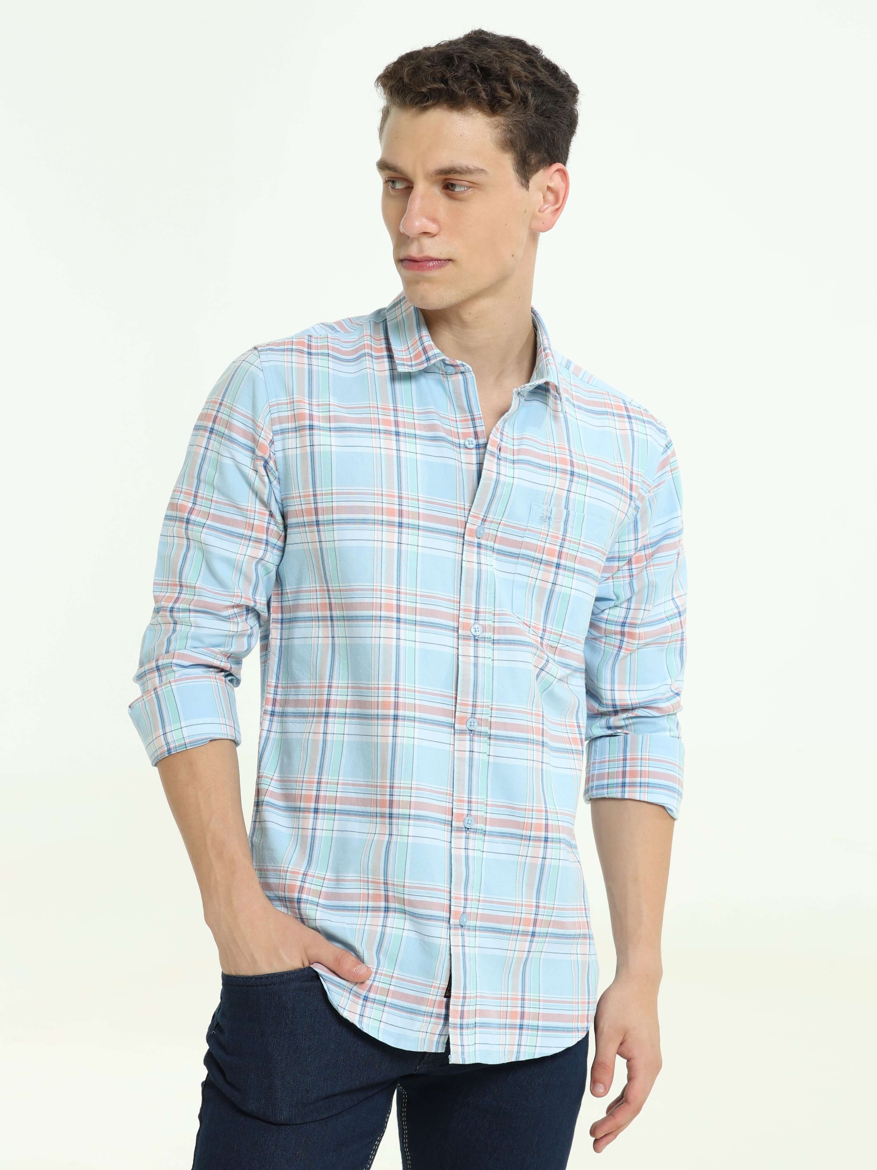 Arctic blue check casual shirt shop online at Estilocus. • Full-sleeve check shirt• Cut and sew placket• Regular collar• Double button square cuff.• Single pocket with logo embroidery• Curved hemline• All double-needle construction, finest quality sewing•