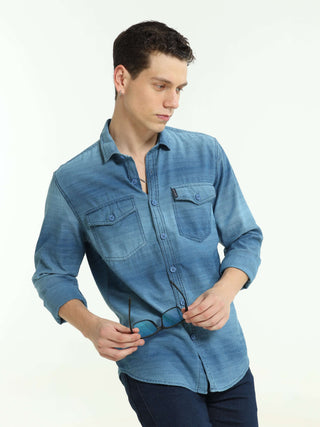 Indigo colored Stripe double pocket shirt shop online at Estilocus. 100% Cotton • Full-sleeve denim shirt• Cut and sew placket• Regular collar• Double button edge cuff • Double pocket with flap • Curved bottom hemline . • All double needle construction, f