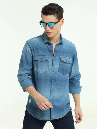 Indigo colored Stripe double pocket shirt shop online at Estilocus. 100% Cotton • Full-sleeve denim shirt• Cut and sew placket• Regular collar• Double button edge cuff • Double pocket with flap • Curved bottom hemline . • All double needle construction, f