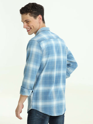 Indigo colored check double pocket shirt shop online at Estilocus. 100% Cotton • Full-sleeve check shirt• Cut and sew placket• Regular collar• Double button edge cuff • Double pocket with flap • Curved bottom hemline . • All double needle construction, fi