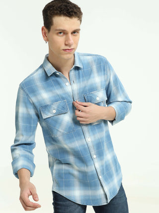 Indigo colored check double pocket shirt shop online at Estilocus. 100% Cotton • Full-sleeve check shirt• Cut and sew placket• Regular collar• Double button edge cuff • Double pocket with flap • Curved bottom hemline . • All double needle construction, fi