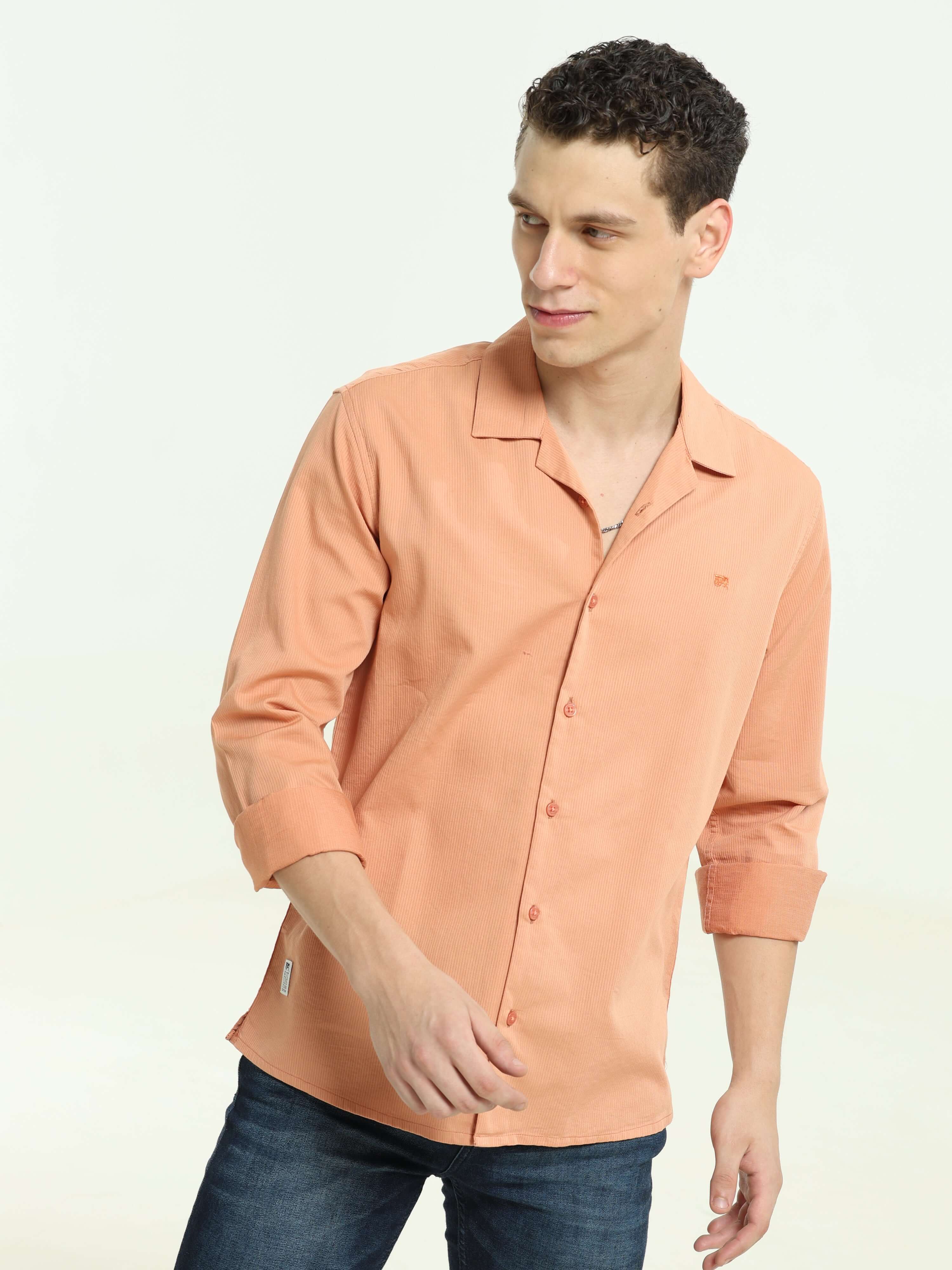 Orange solid cuben colloar shirt shop online at Estilocus. • 100% Cotton , Full-sleeve solid shirt• Cuban collar• Double button edge cuff • Pocketess • Curved bottom hemline . • All double needle construction, finest quality sewing• Machine wash care• Sui