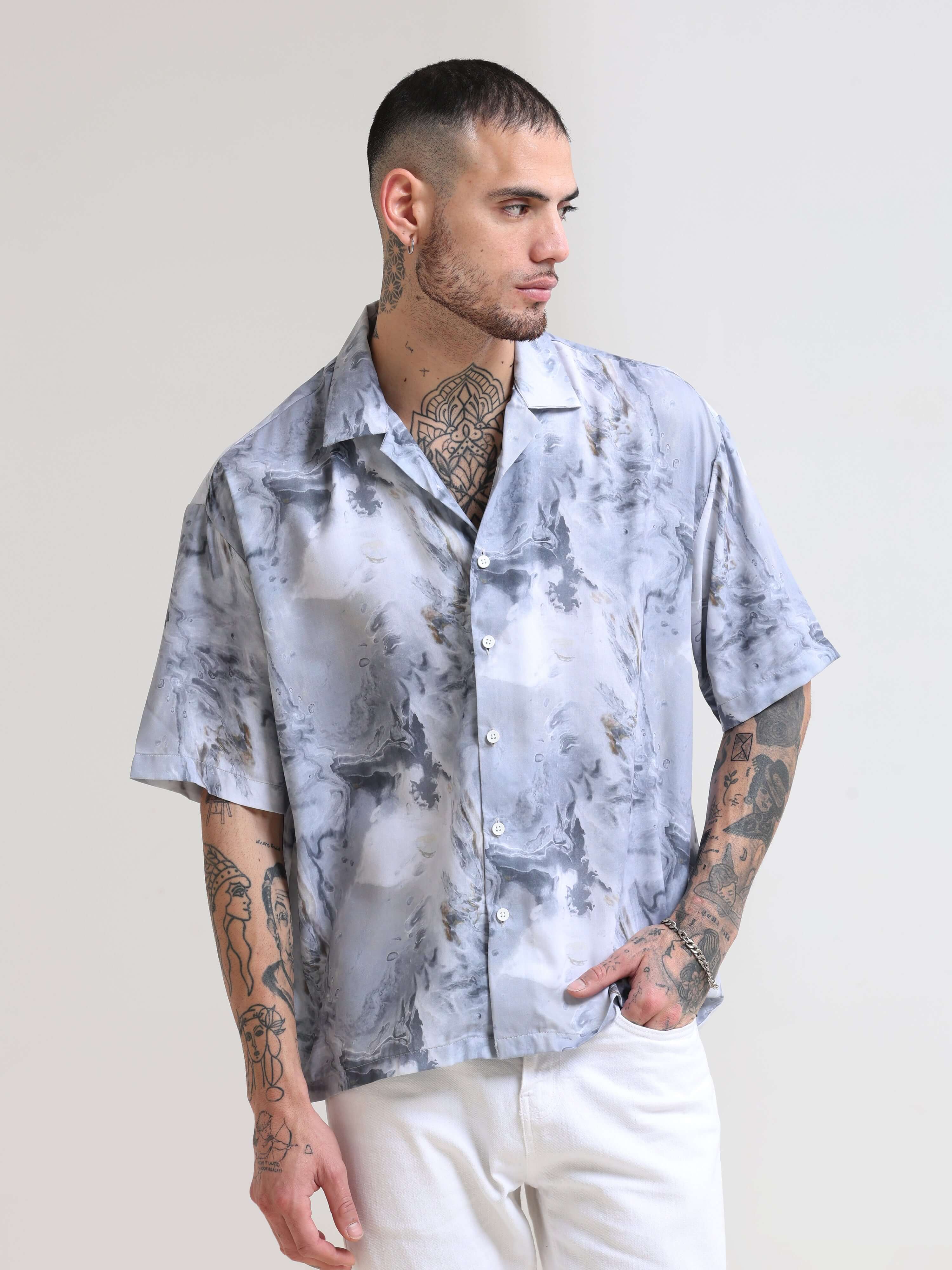 Marble Grey Oversized Shirt shop online at Estilocus. Our Marble Grey Oversized Shirt is perfect for those Hawaiian days. The relaxed fit and lightweight fabric make it comfortable to wear all day. Its classic style is perfect for those summer streetwear