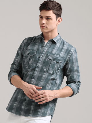 Caribbean Teal Grey Casual Check Shirt shop online at Estilocus. 100% Cotton • Full-sleeve check shirt• Cut and sew placket• Regular collar• Double button edge cuff• Double pocket with flap• Curved bottom hemline .• All double needle construction, finest