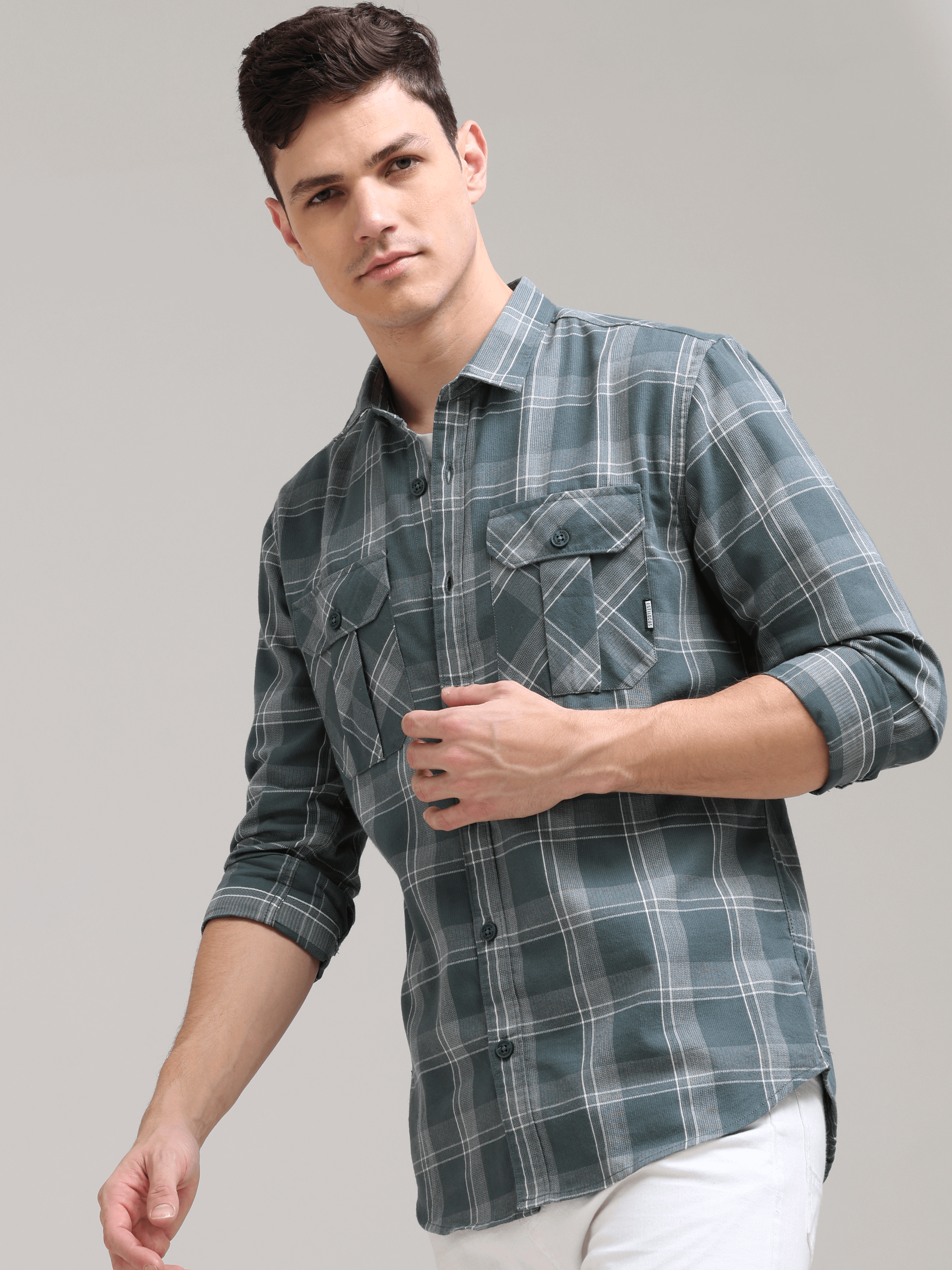 Caribbean Teal Grey Casual Check Shirt shop online at Estilocus. 100% Cotton • Full-sleeve check shirt• Cut and sew placket• Regular collar• Double button edge cuff• Double pocket with flap• Curved bottom hemline .• All double needle construction, finest