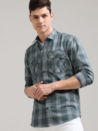 Caribbean Teal Grey Casual Check Shirt shop online at Estilocus. 100% Cotton • Full-sleeve check shirt• Cut and sew placket• Regular collar• Double button edge cuff• Double pocket with flap• Curved bottom hemline .• All double needle construction, finest