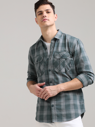 Caribbean Teal Grey Casual Check Shirt shop online at Estilocus. 100% Cotton • Full-sleeve check shirt• Cut and sew placket• Regular collar• Double button edge cuff• Double pocket with flap• Curved bottom hemline .• All double needle construction, finest