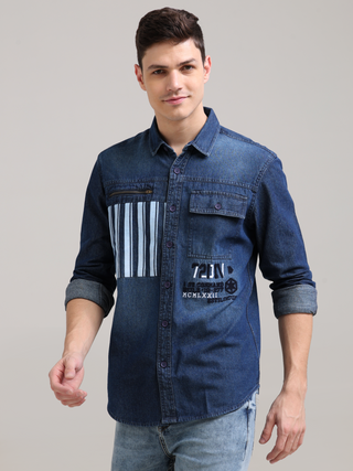 Denim Navy Double Pocket Shirt shop online at Estilocus. Denim ,Full-sleeve shirt Cut and sew placket. Regular collar Double button edge cuff Zipper hidden pocket, other end with flap pocket Curved bottom hemline HD elegant print at pocket All Double need