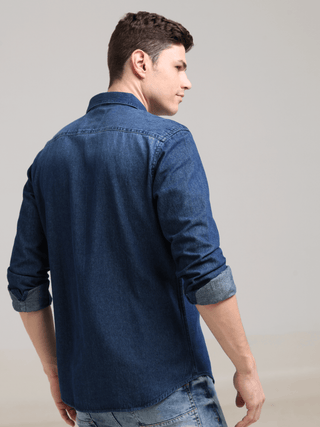 Denim Navy Double Pocket Shirt shop online at Estilocus. Denim ,Full-sleeve shirt Cut and sew placket. Regular collar Double button edge cuff Zipper hidden pocket, other end with flap pocket Curved bottom hemline HD elegant print at pocket All Double need