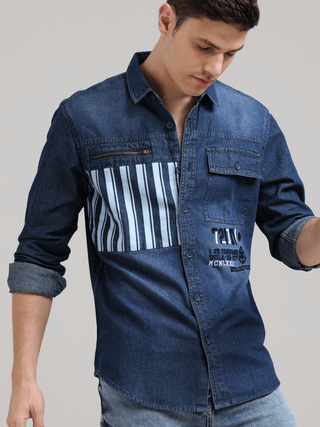 Denim Navy Double Pocket Shirt shop online at Estilocus. Denim ,Full-sleeve shirt Cut and sew placket. Regular collar Double button edge cuff Zipper hidden pocket, other end with flap pocket Curved bottom hemline HD elegant print at pocket All Double need