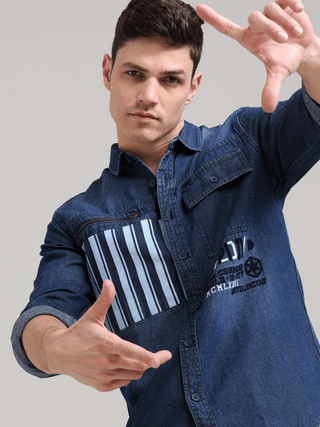 Denim Navy Double Pocket Shirt shop online at Estilocus. Denim ,Full-sleeve shirt Cut and sew placket. Regular collar Double button edge cuff Zipper hidden pocket, other end with flap pocket Curved bottom hemline HD elegant print at pocket All Double need