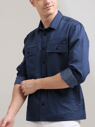 Prussian Blue Denim Shirt shop online at Estilocus. 100% premium Denim Full-sleeve shirt Cut and sew placket. Regular collar Double button edge cuff Double pocket, other end with flap pocket Curved bottom hemline HD elegant print at panal All Double needl