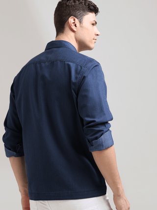 Prussian Blue Denim Shirt shop online at Estilocus. 100% premium Denim Full-sleeve shirt Cut and sew placket. Regular collar Double button edge cuff Double pocket, other end with flap pocket Curved bottom hemline HD elegant print at panal All Double needl