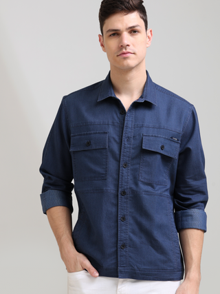 Prussian Blue Denim Shirt shop online at Estilocus. 100% premium Denim Full-sleeve shirt Cut and sew placket. Regular collar Double button edge cuff Double pocket, other end with flap pocket Curved bottom hemline HD elegant print at panal All Double needl