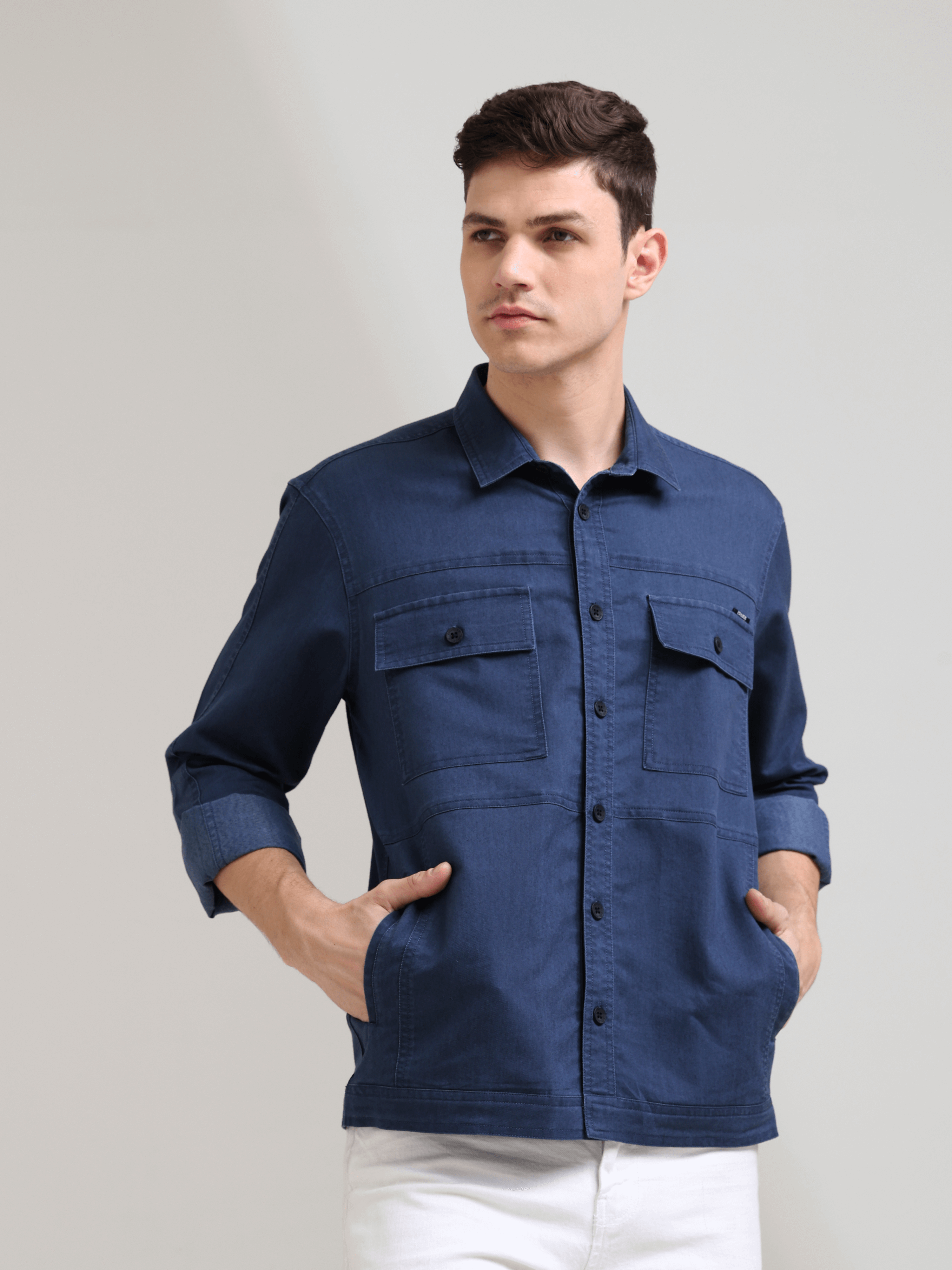Prussian Blue Denim Shirt shop online at Estilocus. 100% premium Denim Full-sleeve shirt Cut and sew placket. Regular collar Double button edge cuff Double pocket, other end with flap pocket Curved bottom hemline HD elegant print at panal All Double needl