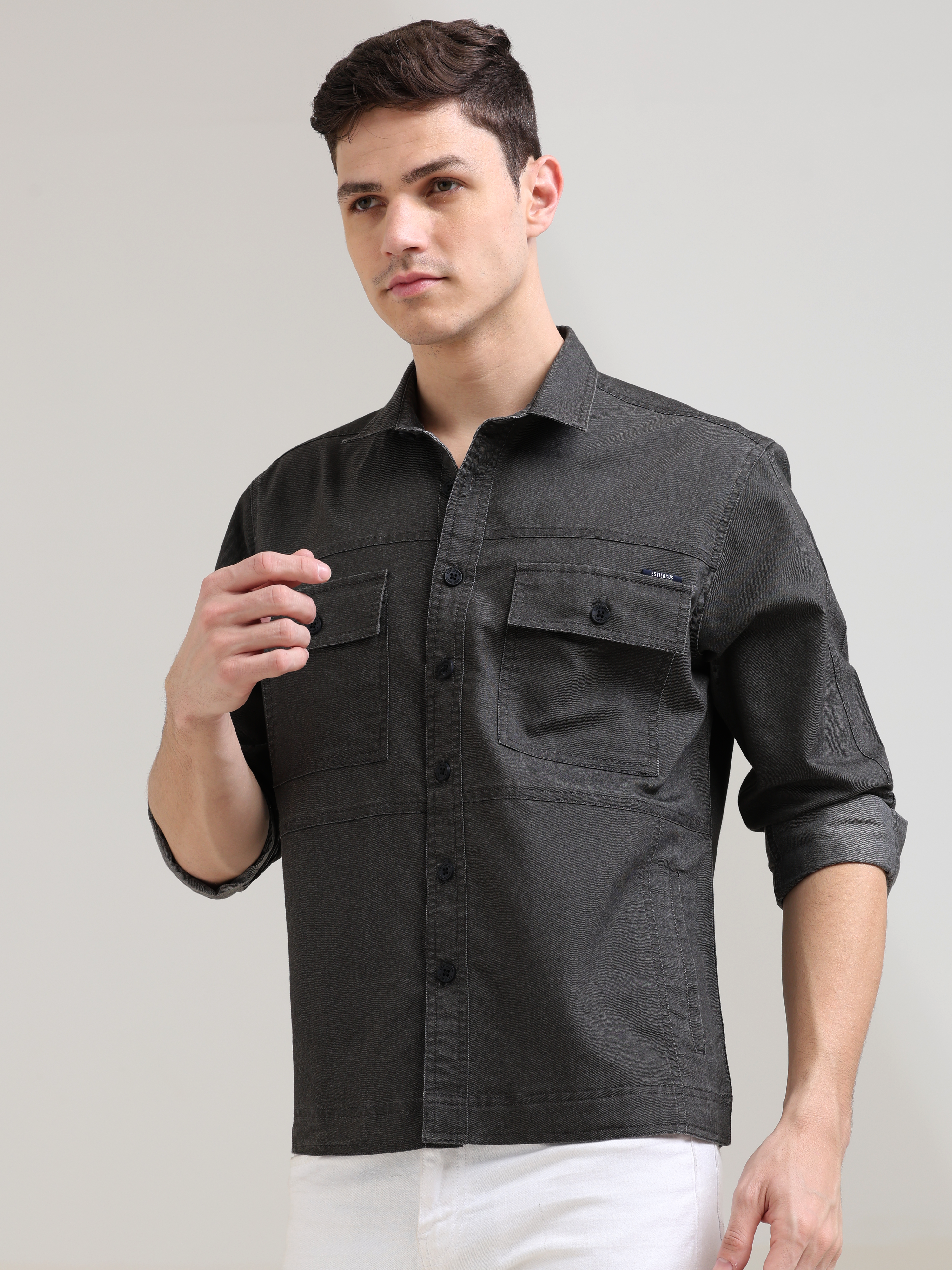 Charcoal Gray Denim Shirt shop online at Estilocus. 100% premium Denim Full-sleeve shirt Cut and sew placket. Regular collar Double button edge cuff Double pocket, other end with flap pocket Curved bottom hemline HD elegant print at panal All Double needl