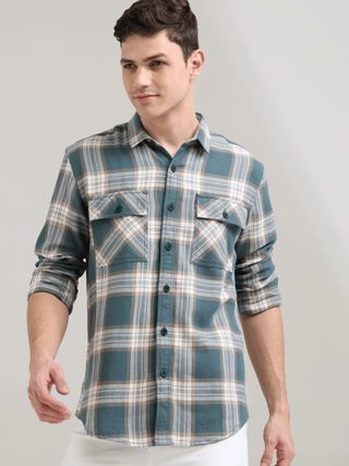 Aegean teal off-white casual check shirt shop online at Estilocus. 100% Cotton • Full-sleeve check shirt• Cut and sew placket• Regular collar• Double button edge cuff• Double pocket with flap• Curved bottom hemline .• All double needle construction, fines