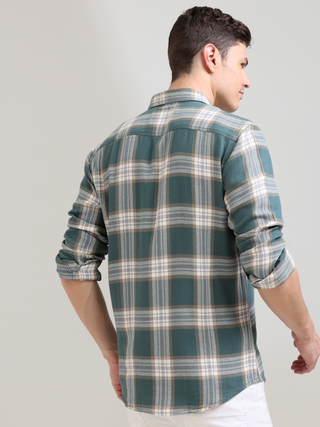 Aegean teal off-white casual check shirt shop online at Estilocus. 100% Cotton • Full-sleeve check shirt• Cut and sew placket• Regular collar• Double button edge cuff• Double pocket with flap• Curved bottom hemline .• All double needle construction, fines