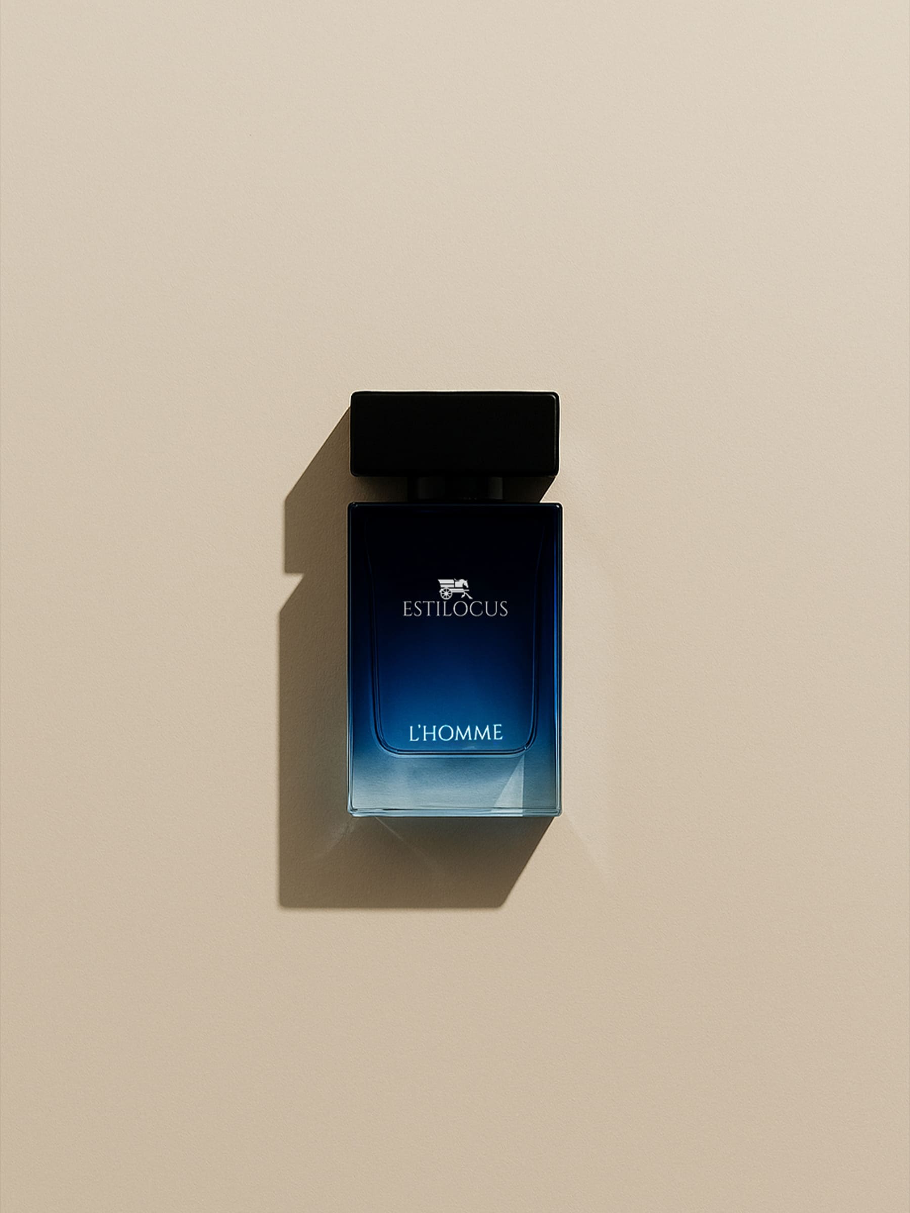 Estilocus L'Homme perfume bottle on a beige background