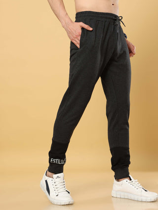 Grey Joggers With Adjustable Draw String shop online at Estilocus. •High GSM knitted breathable fabric. •Elastic waistband with an adjustable drawcord secures your fit • Bottom rib with patchwork fabric with finest quality print unique design. • Insert po