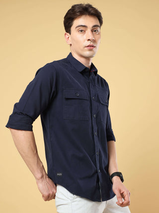 Navy Twill Solid Cargo Shirt shop online at Estilocus. • 100% premium cotton• Full-sleeve solid shirt• Cut and sew placket• Regular collar• Double button round cuff's.• Double pocket with flap.• Finest embroidery on sleeve and front panel• Curved hemline•