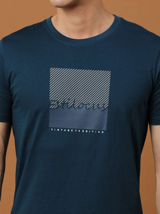 Teal Blue Vintage 72 Edition T Shirt shop online at Estilocus. 100% Cotton Designed and printed on knitted fabric. The fabric is stretchy and lightweight, with a soft skin feel and no wrinkles. Crew neck collar which is smooth on the neck and keeps you co