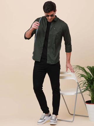 Dark Green Solid Single Pocket full sleeve shirt shop online at Estilocus. 100% Cotton ,Full-sleeve solid shirt Cut and sew placket Regular collar Double button edge cuff Single pocket with flap Curved bottom hemline Finest printing at front placket. All