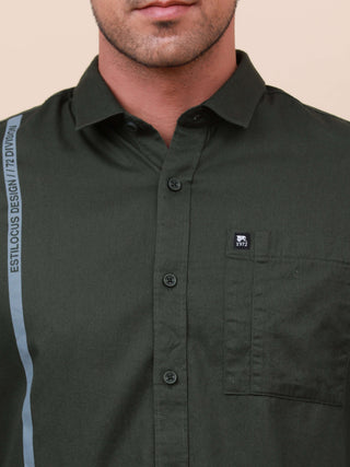 Dark Green Solid Single Pocket full sleeve shirt shop online at Estilocus. 100% Cotton ,Full-sleeve solid shirt Cut and sew placket Regular collar Double button edge cuff Single pocket with flap Curved bottom hemline Finest printing at front placket. All