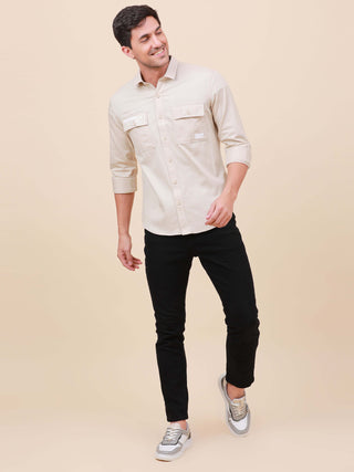 Beige Solid Double Pocket Full-Sleeve Shirt shop online at Estilocus. 100% Cotton , Full-sleeve solid shirt Cut and sew placket Regular collar Double button edge cuff Double pocket with flap Curved bottom hemline Finest printing at pocket . All double nee