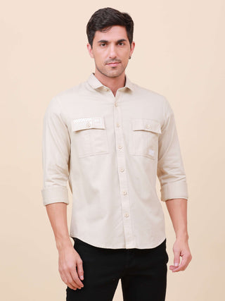 Beige Solid Double Pocket Full-Sleeve Shirt shop online at Estilocus. 100% Cotton , Full-sleeve solid shirt Cut and sew placket Regular collar Double button edge cuff Double pocket with flap Curved bottom hemline Finest printing at pocket . All double nee