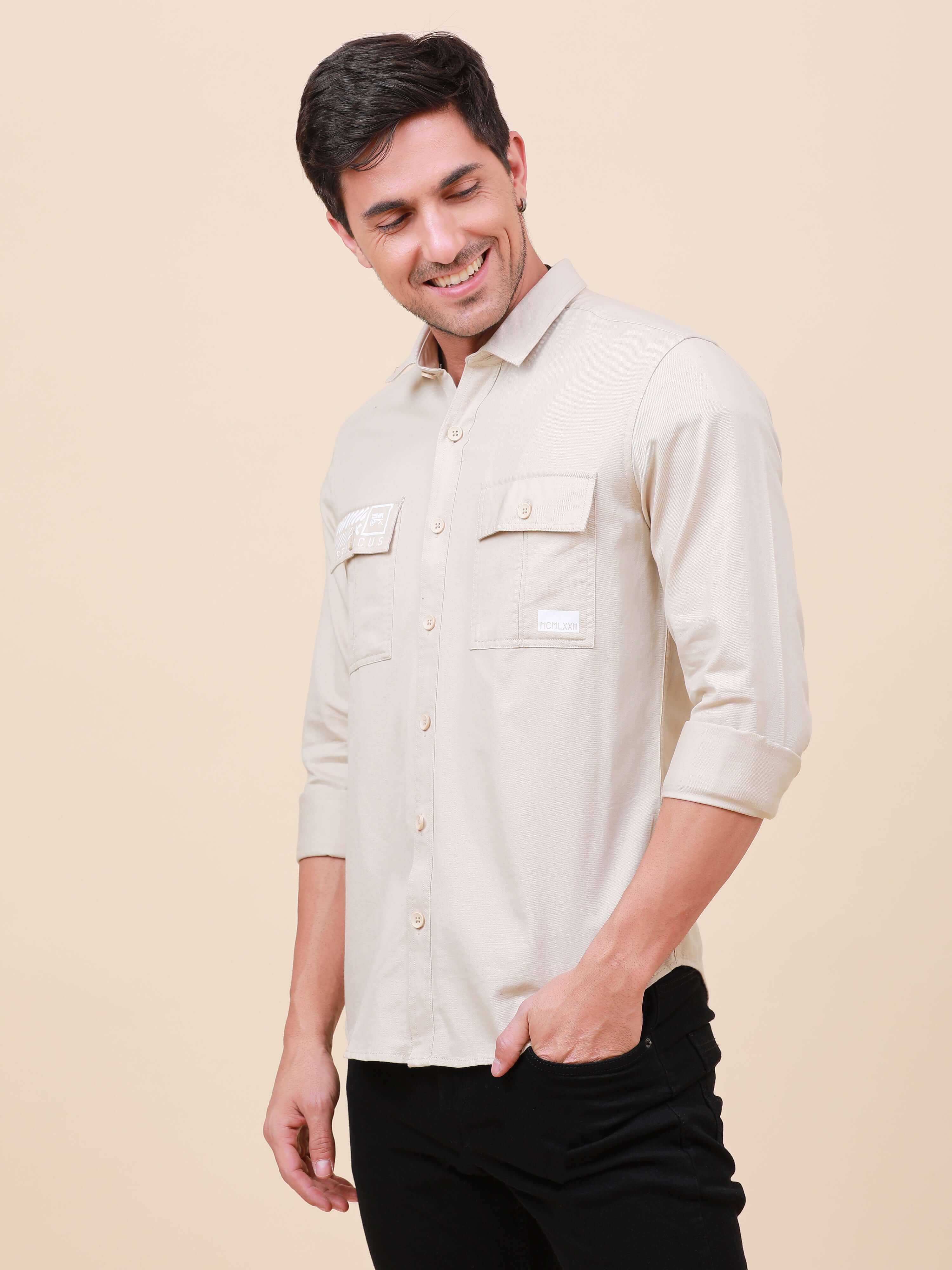 Beige Solid Double Pocket Full-Sleeve Shirt shop online at Estilocus. 100% Cotton , Full-sleeve solid shirt Cut and sew placket Regular collar Double button edge cuff Double pocket with flap Curved bottom hemline Finest printing at pocket . All double nee