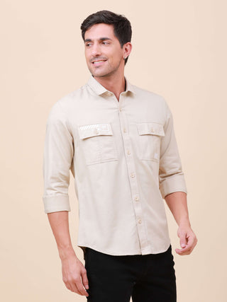 Beige Solid Double Pocket Full-Sleeve Shirt shop online at Estilocus. 100% Cotton , Full-sleeve solid shirt Cut and sew placket Regular collar Double button edge cuff Double pocket with flap Curved bottom hemline Finest printing at pocket . All double nee