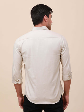 Beige Solid Double Pocket Full-Sleeve Shirt shop online at Estilocus. 100% Cotton , Full-sleeve solid shirt Cut and sew placket Regular collar Double button edge cuff Double pocket with flap Curved bottom hemline Finest printing at pocket . All double nee