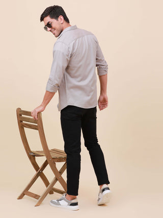 Grey Solid Double Pocket Shirt shop online at Estilocus. 100% Cotton , Full-sleeve solid shirt Cut and sew placket Regular collar Double button edge cuff Double pocket with flap Curved bottom hemline Finest printing at pocket . All double needle construct