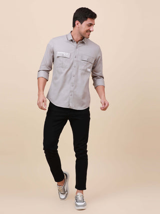 Grey Solid Double Pocket Shirt shop online at Estilocus. 100% Cotton , Full-sleeve solid shirt Cut and sew placket Regular collar Double button edge cuff Double pocket with flap Curved bottom hemline Finest printing at pocket . All double needle construct