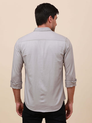 Grey Solid Double Pocket Shirt shop online at Estilocus. 100% Cotton , Full-sleeve solid shirt Cut and sew placket Regular collar Double button edge cuff Double pocket with flap Curved bottom hemline Finest printing at pocket . All double needle construct