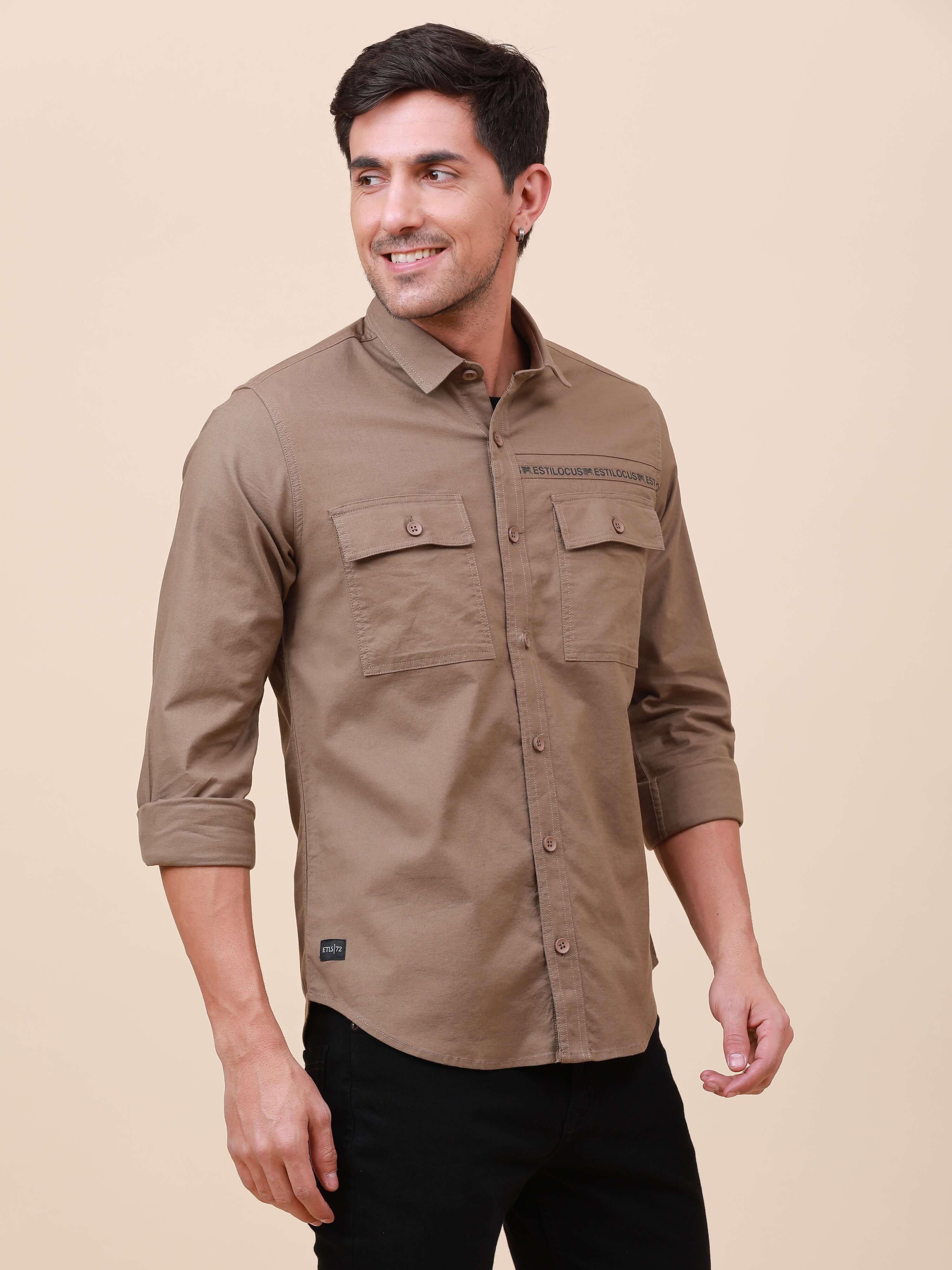 Khaki Solid Double Pocket Shirt shop online at Estilocus. 100% Cotton , Full-sleeve solid shirt Cut and sew placket Regular collar Double button edge cuff Double pocket with flap Curved bottom hemline Finest printing at front placket. All double needle co