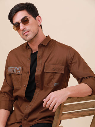 Coffee Brown Solid Double Pocket Shirt shop online at Estilocus. 100% Cotton , Full-sleeve solid shirt Cut and sew placket Regular collar Double button edge cuff Double pocket with flap Curved bottom hemline Finest printing at pocket . All double needle c