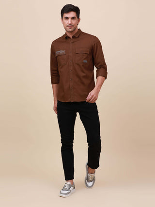 Coffee Brown Solid Double Pocket Shirt shop online at Estilocus. 100% Cotton , Full-sleeve solid shirt Cut and sew placket Regular collar Double button edge cuff Double pocket with flap Curved bottom hemline Finest printing at pocket . All double needle c