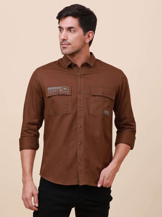 Coffee Brown Solid Double Pocket Shirt shop online at Estilocus. 100% Cotton , Full-sleeve solid shirt Cut and sew placket Regular collar Double button edge cuff Double pocket with flap Curved bottom hemline Finest printing at pocket . All double needle c