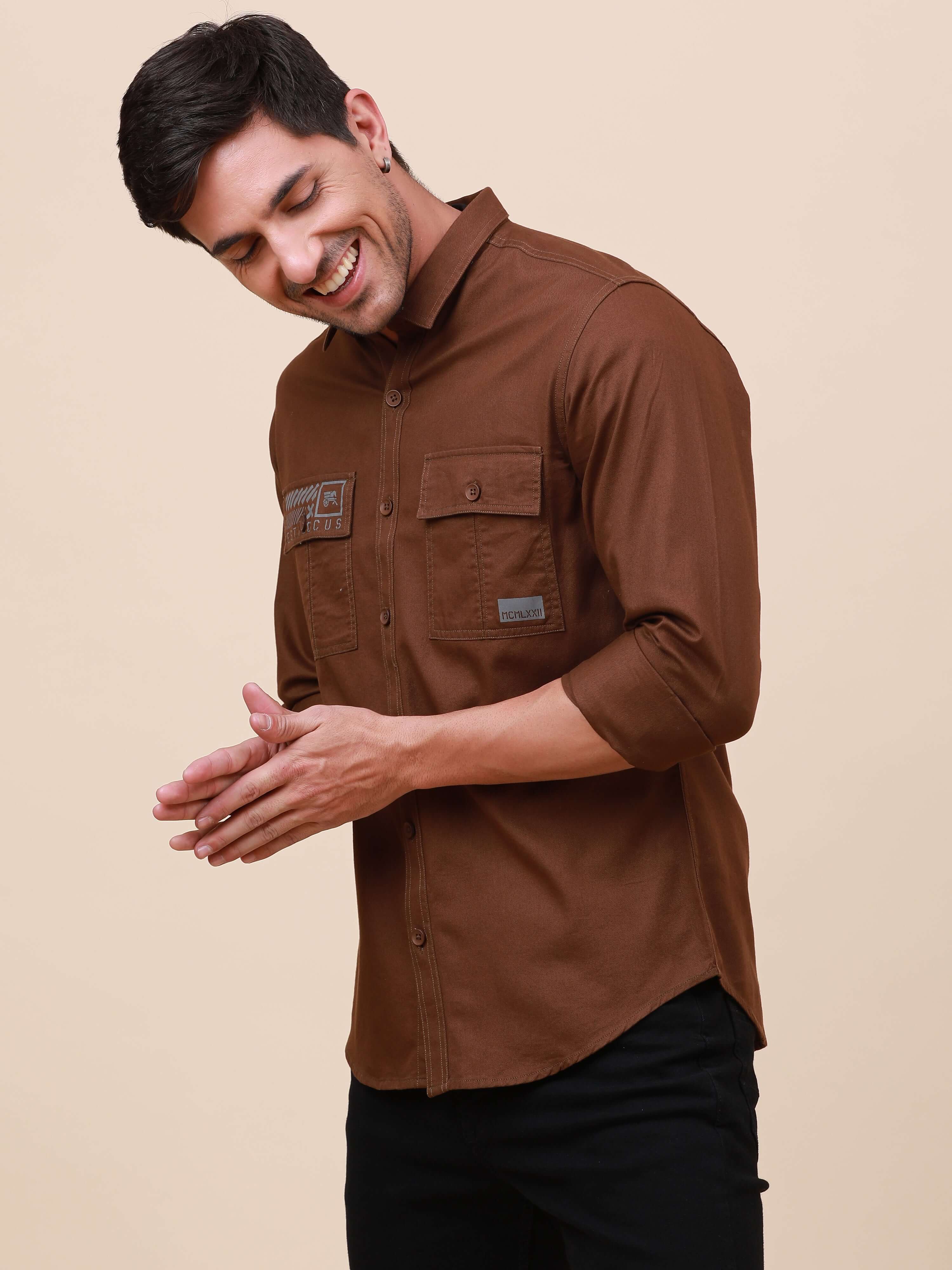Coffee Brown Solid Double Pocket Shirt shop online at Estilocus. 100% Cotton , Full-sleeve solid shirt Cut and sew placket Regular collar Double button edge cuff Double pocket with flap Curved bottom hemline Finest printing at pocket . All double needle c