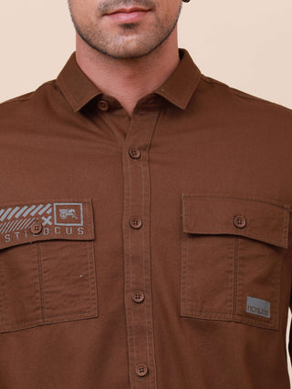 Coffee Brown Solid Double Pocket Shirt shop online at Estilocus. 100% Cotton , Full-sleeve solid shirt Cut and sew placket Regular collar Double button edge cuff Double pocket with flap Curved bottom hemline Finest printing at pocket . All double needle c