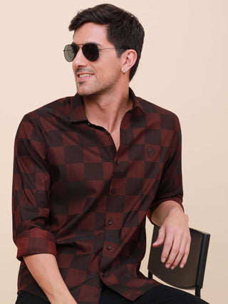 Maroon Check Pocketless Shirt shop online at Estilocus. 100% Cotton ,Full-sleeve checks shirt Self fold placket Regular collar Double button edge cuff Pocketless Curved bottom hemline Finest quality brand embroidery at front placket. All single needle con