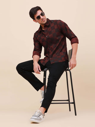 Maroon Check Pocketless Shirt shop online at Estilocus. 100% Cotton ,Full-sleeve checks shirt Self fold placket Regular collar Double button edge cuff Pocketless Curved bottom hemline Finest quality brand embroidery at front placket. All single needle con