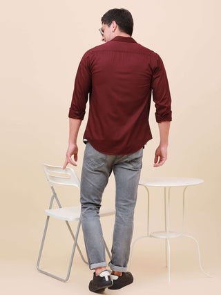 Plum Solid Single Pocket Shirt shop online at Estilocus. 100% Cotton ,Full-sleeve solid shirt Cut and sew placket Regular collar Double button edge cuff Single pocket Curved bottom hemline Finest printing at front placket. All double needle construction,