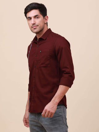 Plum Solid Single Pocket Shirt shop online at Estilocus. 100% Cotton ,Full-sleeve solid shirt Cut and sew placket Regular collar Double button edge cuff Single pocket Curved bottom hemline Finest printing at front placket. All double needle construction,