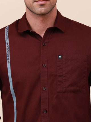 Plum Solid Single Pocket Shirt shop online at Estilocus. 100% Cotton ,Full-sleeve solid shirt Cut and sew placket Regular collar Double button edge cuff Single pocket Curved bottom hemline Finest printing at front placket. All double needle construction,