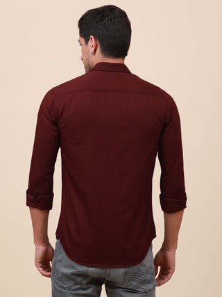 Plum Solid Single Pocket Shirt shop online at Estilocus. 100% Cotton ,Full-sleeve solid shirt Cut and sew placket Regular collar Double button edge cuff Single pocket Curved bottom hemline Finest printing at front placket. All double needle construction,